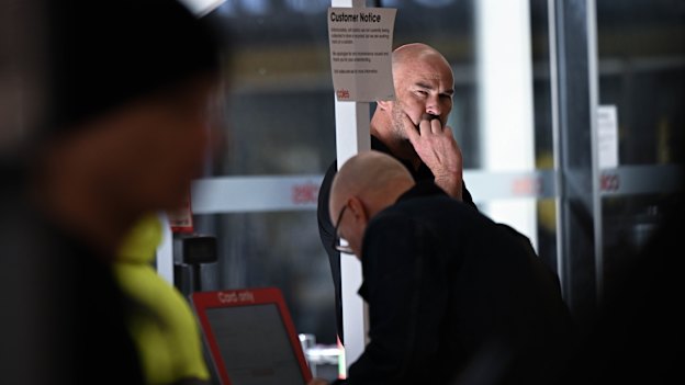 A security officer keeps watch at Coles in Prahran.