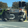 No injuries as car rolls at Canberra intersection