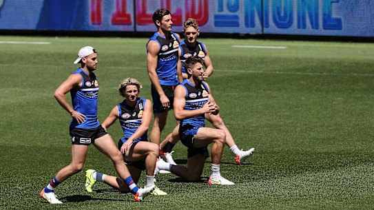 The Western Bulldogs warm up prior to a training session in Perth.