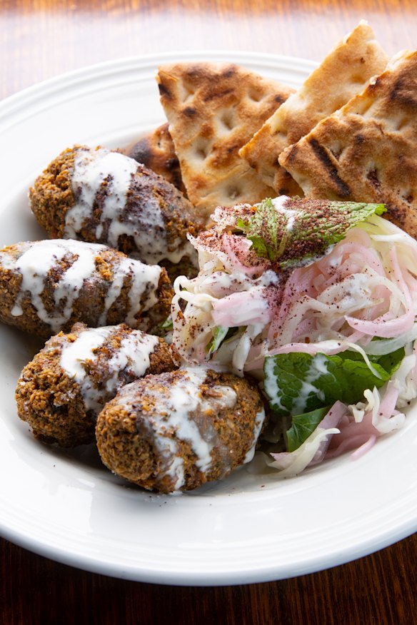 Falafels with babaghanoush, slaw and flatbread.