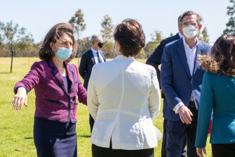 NSW Premier Gladys Berejiklian, left, and Treasurer Dominic Perrottet, far right, on Monday.
