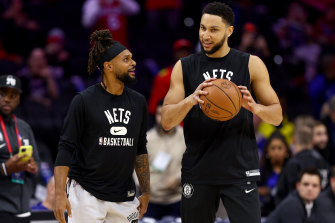 Australians Patty Mills and Ben Simmons warm up before the Nets played the 76ers in Philadelphia.