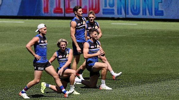 The Western Bulldogs warm up prior to a training session in Perth.