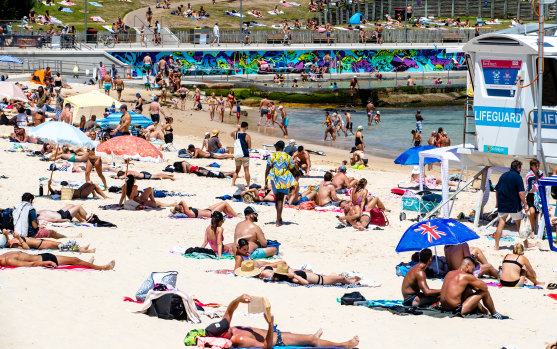 People flocked to Bondi Beach on Monday as Sydney sweltered through a heatwave. 