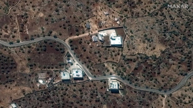 The reported residence of the late IS leader, Abu Bakr al-Baghdadi, in north-western Syria near the village of Barisha, top right.