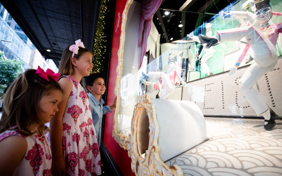 Siblings, Charlotte, 8, Louis, 5, and Amelia, 3, Smith looking at the David Jones Christmas windows in Sydney.