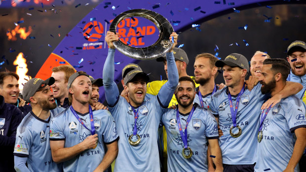 Sydney FC players celebrate after winning last year's A-League grand final.