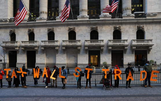 The game is rigged: Protesters outside the New York Stock Exchange on Wall Street.