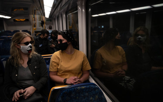 Passengers wear masks at Central on August 27.