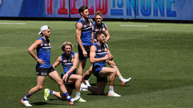 The Western Bulldogs warm up prior to a training session in Perth.