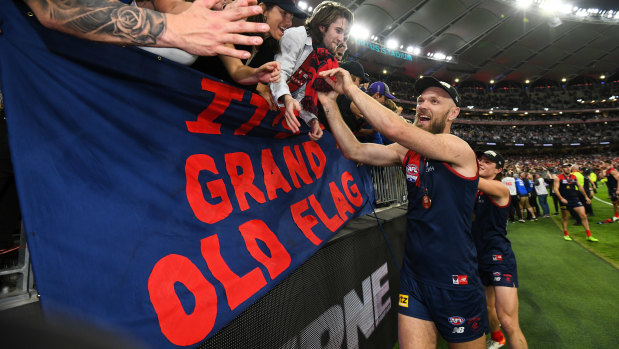 Max Gawn celebrates with the Melbourne faithful after the Demons’ grand final win in Perth.