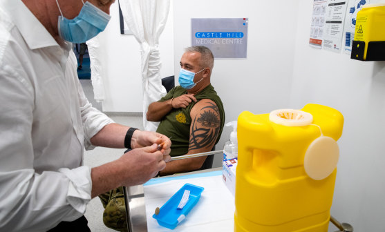 A man receives the Pfizer vaccine in Sydney last month.