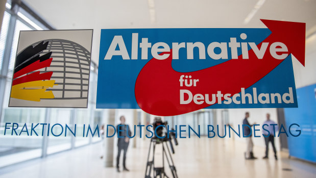 The logo of the Bundestag faction of the right-wing Alternative for Germany (AfD) political party  stands at the entrance to the AfD Bundestag faction at the Reichstag in Berlin. 