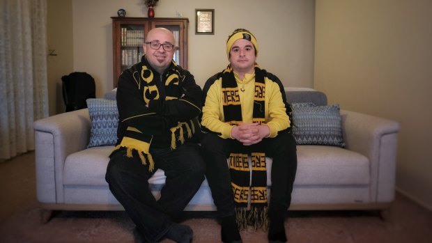 Richmond fans Ali Yesilyurt and his son Salih at their home in Roxburgh Park.