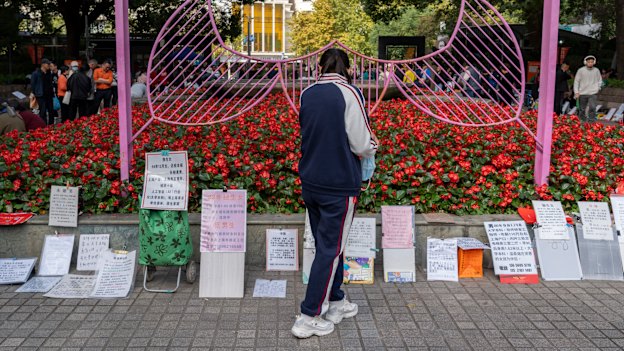 Information of unmarried adults and request of desired partners are displayed at the marriage market in Shanghai. 