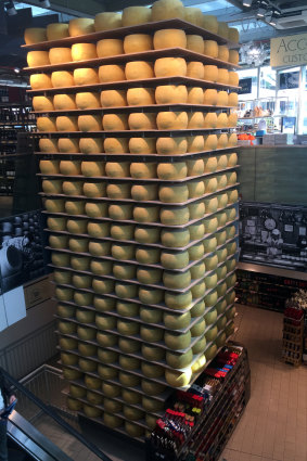 A tower of parmesan takes centre stage at a deli in Parma.