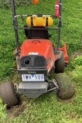 A bogged lawnmower in wet ground used by Department of Transport subcontractors recently.
