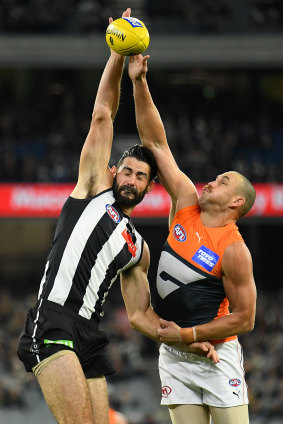 Brodie Grundy of the Magpies and Shane Mumford of the Giants compete in the ruck.