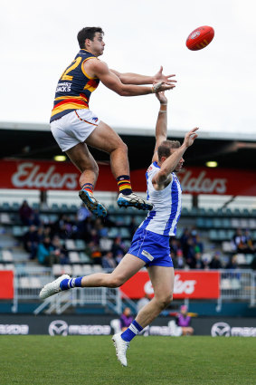 Darcy Fogarty takes a big mark over Josh Walker.