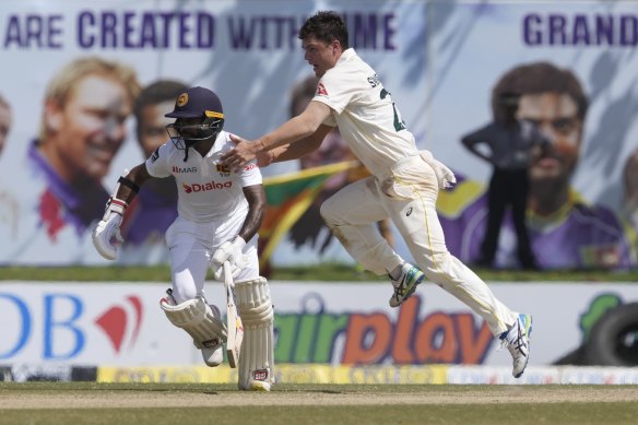 Mitchell Swepson attempts to run towards the ball as Sri Lanka’s Niroshan Dickwella watches on.