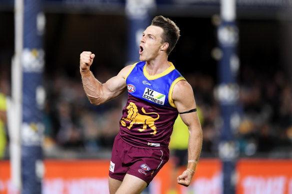 Lincoln McCarthy celebrates kicking a goal for the Lions.