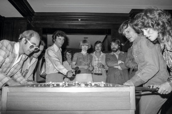 Bernie Taupin at the Playboy mansion: “Elton and I take on Hugh Hefner and Barbie Benton at foosball at the Chicago Playboy Mansion, 1975. We won!”