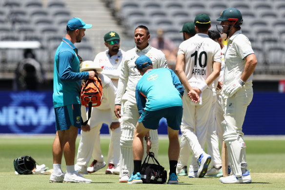 Usman Khawaja received treatment after being hit on the forearm on Sunday.
