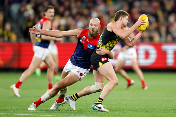 Jacob Hopper tackled by Max Gawn.