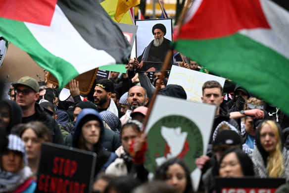 Protesters march during a pro-Palestine rally for Gaza and Lebanon at the State Library of Victoria last week. 