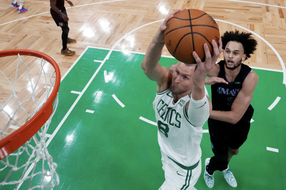 Kristaps Porzingis #8 of the Boston Celtics dunks the ball.