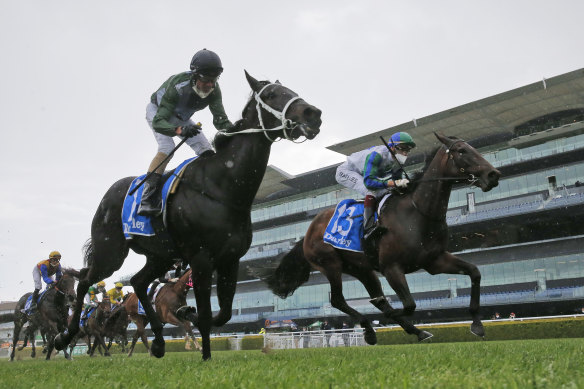 Never Been Kissed (right) wins the group 1 Flight Stakes on Saturday.