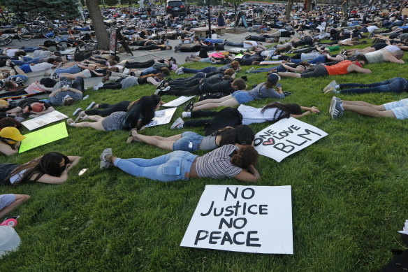 Protesters lie down for eight minutes and 46 seconds during a protest at the University of Utah.
