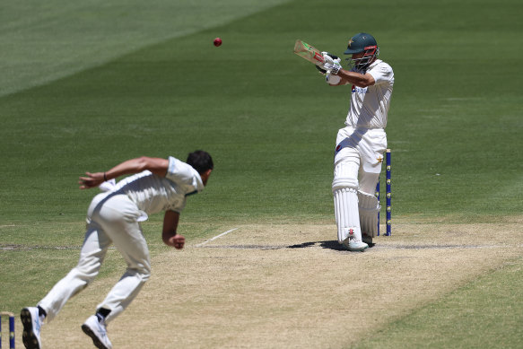 Shan Masood belts a delivery from Australia’s Mitchell Starc during the fourth day.