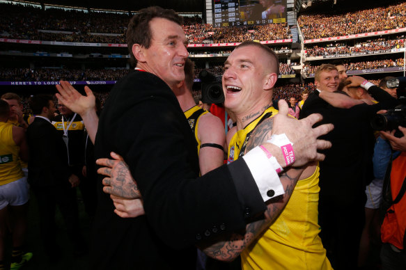 Brendon Gale (left) and Dustin Martin embrace after the 2017 grand final. 