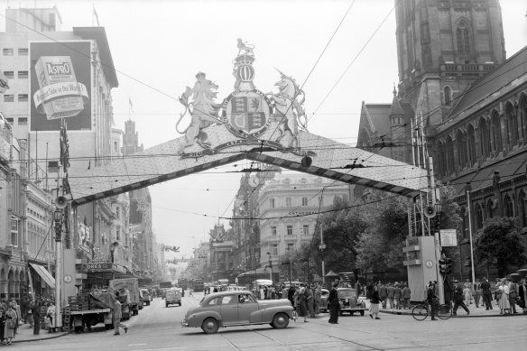 Swanston Street framed by an impressive arch near St Paul's Cathedral along the Queen's route.