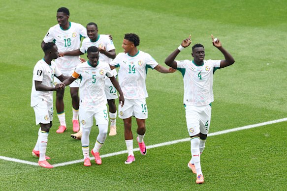 Abdoulaye Seck celebrates his goal against Iraq.