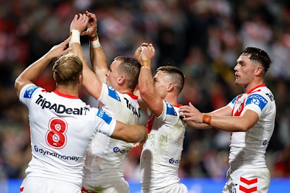 Clint Gutherson celebrates a try with the “burger” gesture.