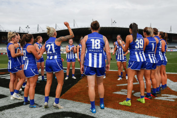 North Melbourne celebrate their close semi-final win over Collingwood. 