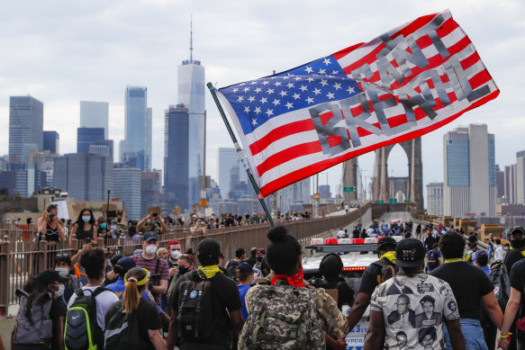 Protesters march on Brooklyn Bridge after a rally in New York following the death of George Floyd, 2020.