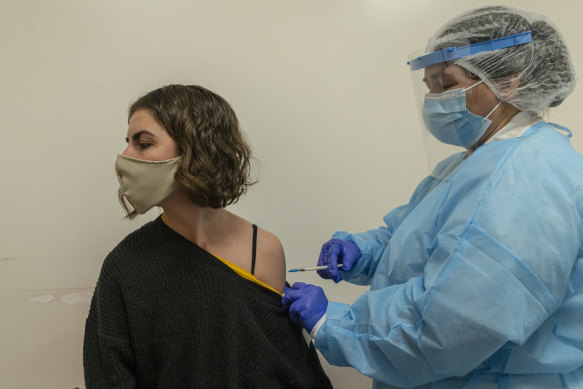 A woman in Montevideo, Uruguay gets vaccinated.