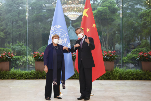 United Nations High Commissioner for Human Rights Michelle Bachelet was criticised for not confronting China during her visit there in May. In this photo, she is meeting Chinese Foreign Minister Wang Yi in Beijing in May.
