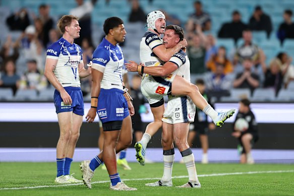 Reed Mahoney celebrates a Cowboys try with Scott Drinkwater.