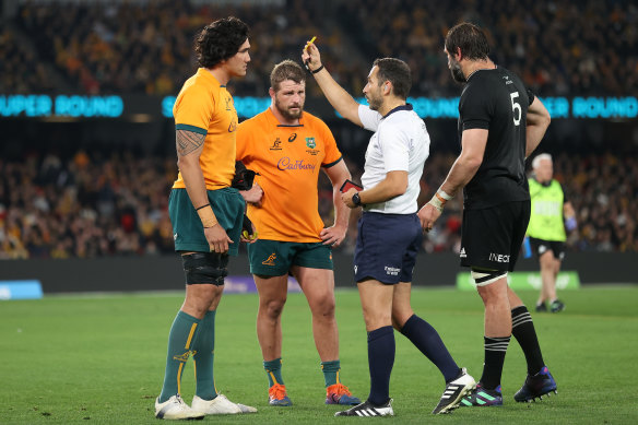 Darcy Swain is shown a yellow card for a dangerous tackle on Quinn Tupaea.