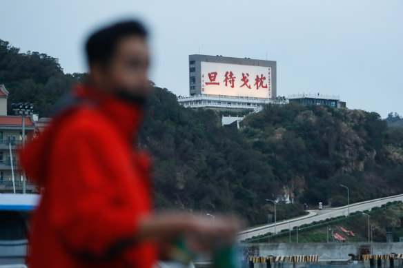A billboard on Taiwan’s Mazu Island carries a message reminding people to be ready to fight.