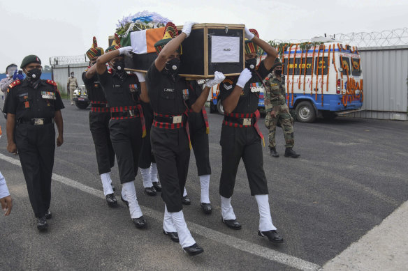 Indian army soldiers carry the coffin of a colleague killed during a confrontation with Chinese soldiers in the Ladakh region in June 2020. The clashes at the disputed border between India and China was the worst since 1975.