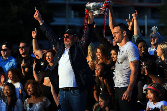 Toronto Wolfpack owner David Argyle, left, lifts the Championship 1 Promotion Trophy in 2017.