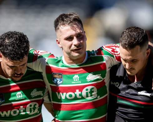 Lachie Ilias is assisted from the field on Saturday.