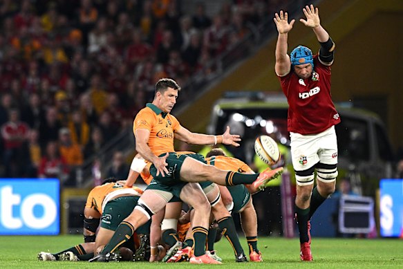 A Lions player tries to smother a kick from Wallaby Jake Gordon in Brisbane earlier this month.