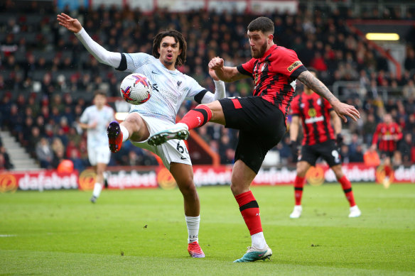 Liverpool’s Trent Alexander-Arnold and Bournemouth’s Marcos Senesi fight for possession at Vitality Stadium in Bournemouth on Saturday.