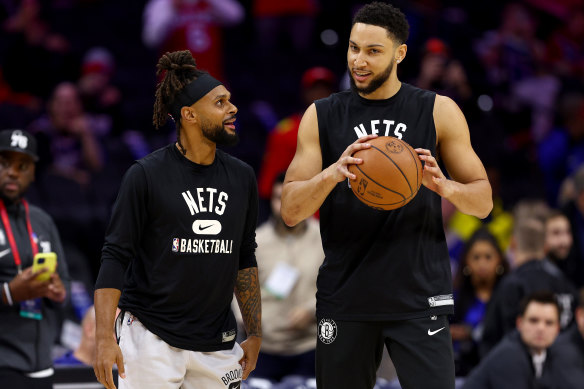 Simmons with fellow Australian and teammate Patty Mills, who has helped him through tough times. 